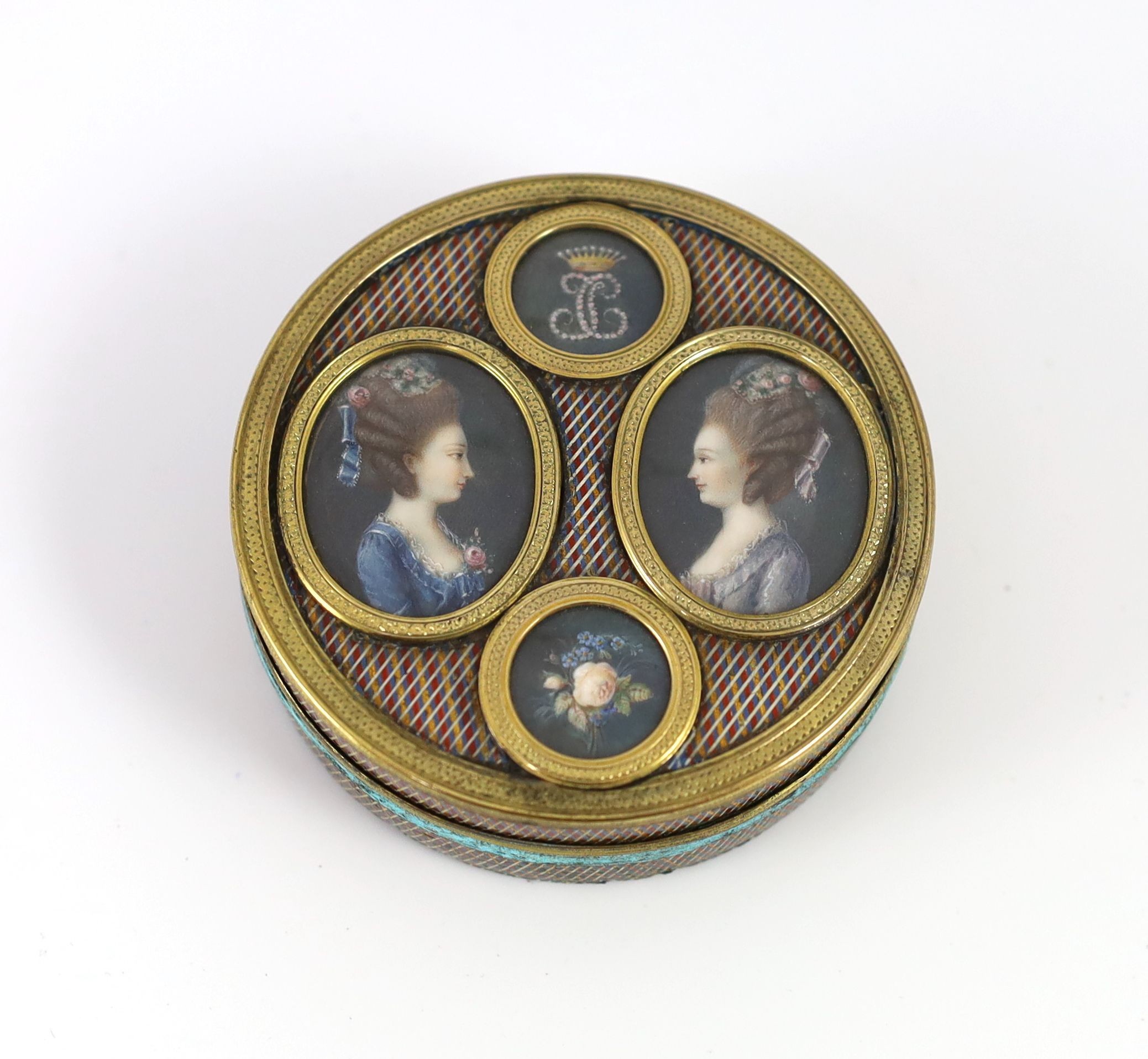 A late 18th century tortoiseshell poudre d'écaille box, the cover inset with two portraits of young ladies, below a monogram ‘JC’ with coronet, mounted in gilt metal 8cm diameter